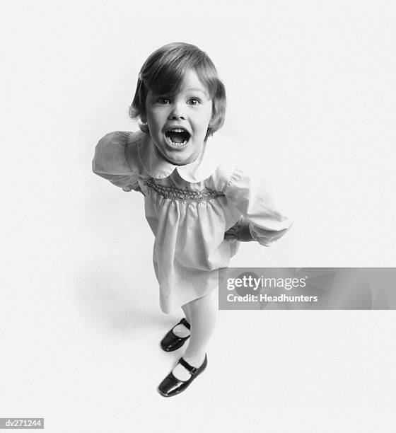 little girl with hands of hips, yelling - headhunters stock-fotos und bilder