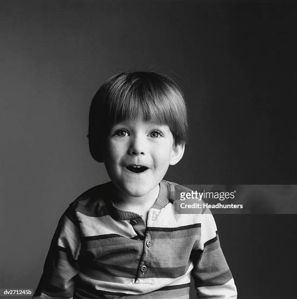 boy smiling with mouth open - headhunters stock pictures, royalty-free photos & images