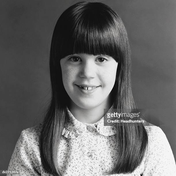 smiling girl with long hair and bangs - headhunters stock-fotos und bilder