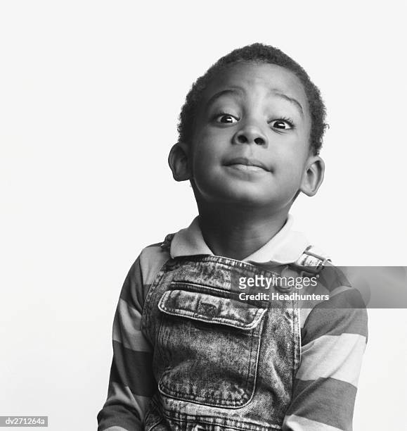 little boy with wise look on his face - headhunters stock-fotos und bilder
