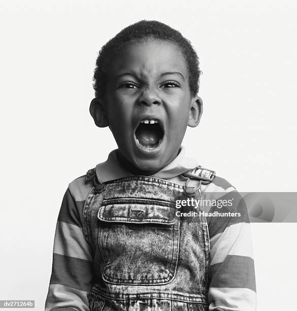 little boy yelling - headhunters stock-fotos und bilder