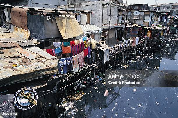 dilapidated homes, manila - philippines environment pollution water poverty stock pictures, royalty-free photos & images