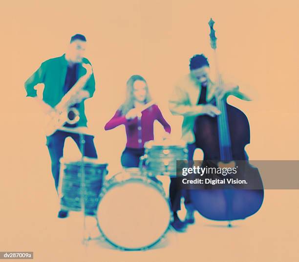 hazy image of band with sax, drums and double bass - bass drum stock-fotos und bilder