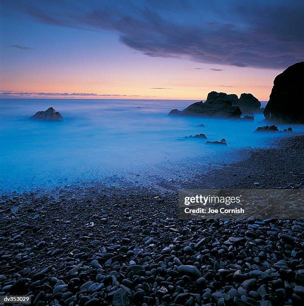 misty beach - copeland england stock pictures, royalty-free photos & images