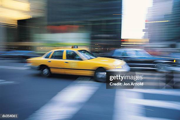 speeding yellow cab - jon stock pictures, royalty-free photos & images