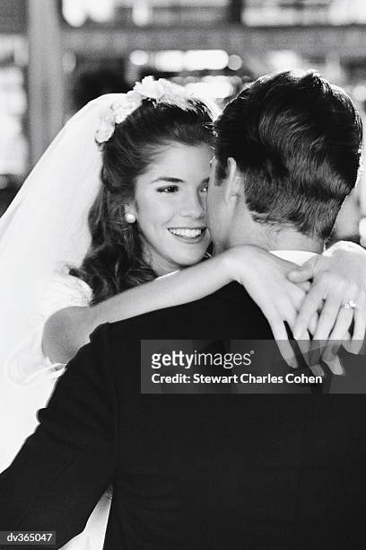 bride hugging groom - stewart stock pictures, royalty-free photos & images