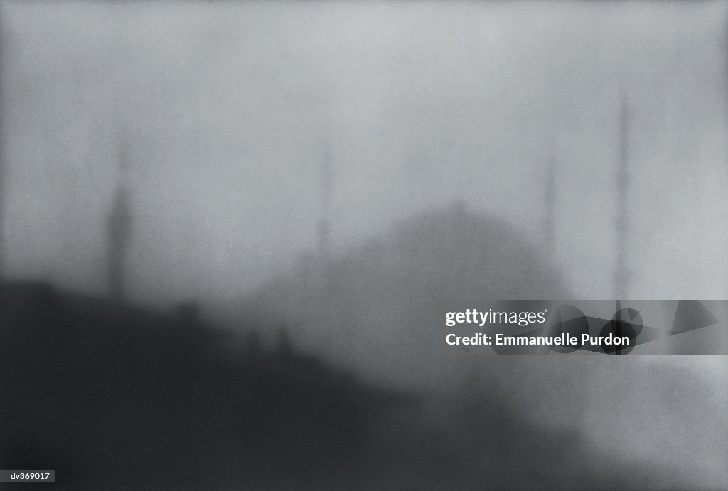 Hill covered in mist and fog