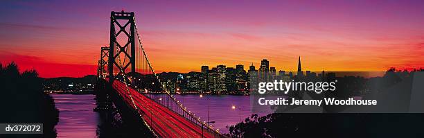 san francisco's bay bridge at sunset - san francisco bay bridge 個照片及圖片檔