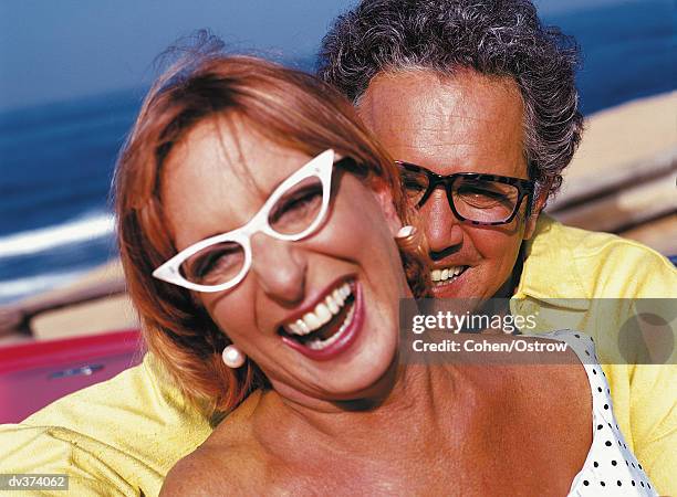 happy couple in glasses, laughing - cats eye glasses photos et images de collection