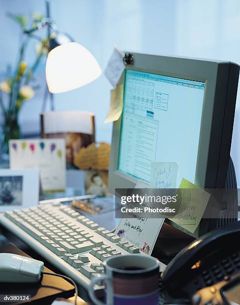 Under Computer Monitor Notes 57 Business Computer Monitor Stuck Stock Photos, High-Res Pictures, and ...