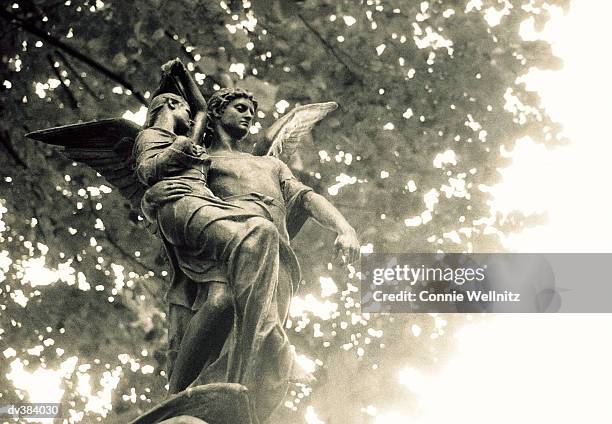 statue of st michael, pere lachaise cemetery, paris, france, europe - connie stock pictures, royalty-free photos & images