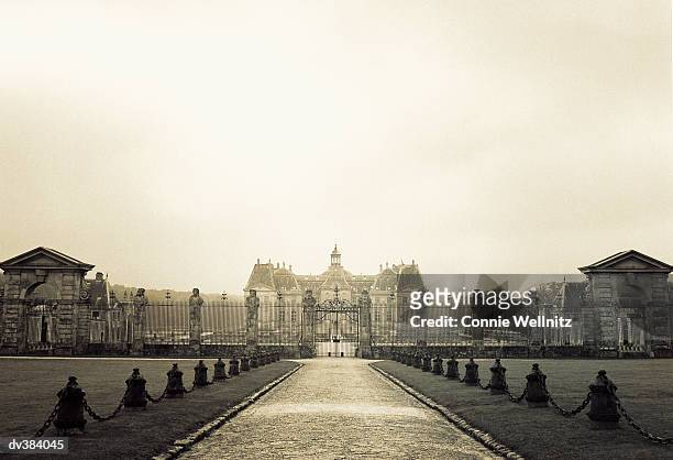 mansion behind large fence - connie stock pictures, royalty-free photos & images