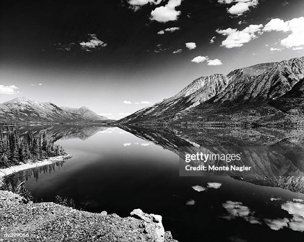 lake between mountains - montre stock pictures, royalty-free photos & images