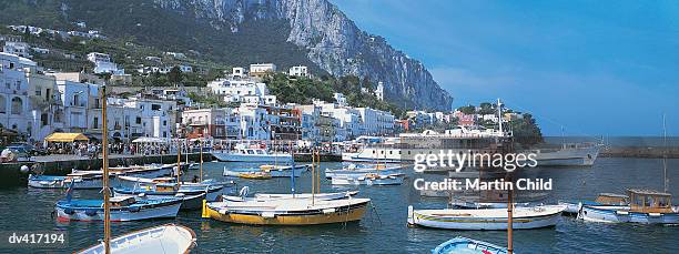 sailing boats moored in the harbour in marina grande, capri, italy - tyrrhenisches meer stock-fotos und bilder