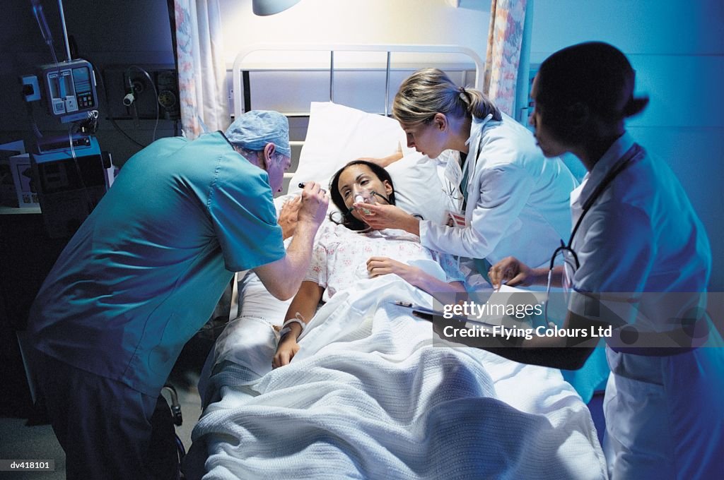 Doctor and nurses taking care of patient