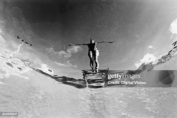 diver on board - diving black and white stock pictures, royalty-free photos & images