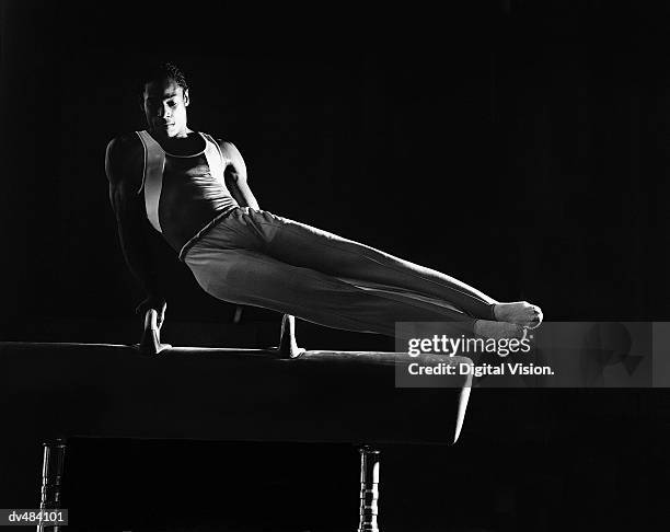 gymnast on pommel horse - gymnastics stock pictures, royalty-free photos & images