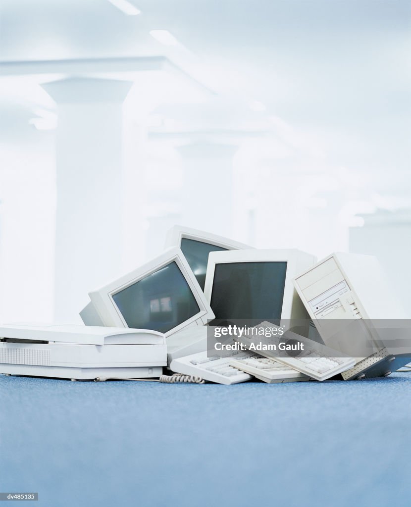 Pile of Computers, Scanners, Monitors and Keyboards in an Office