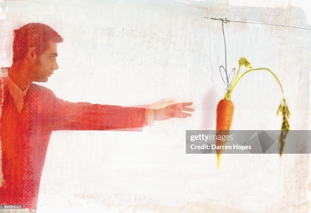 Man reaching for a carrot