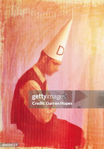 Dunce Graphics Businessman With A Dunce Cap On High-Res Vector Graphic - Getty Images