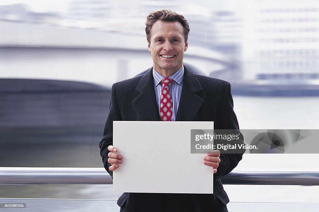Businessman holding a piece of paper