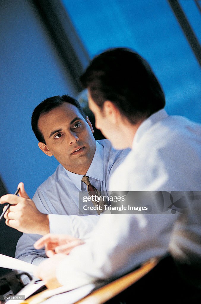 Two businessmen talking