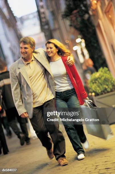 couple walking down via condotti, rome, italy - via stock pictures, royalty-free photos & images