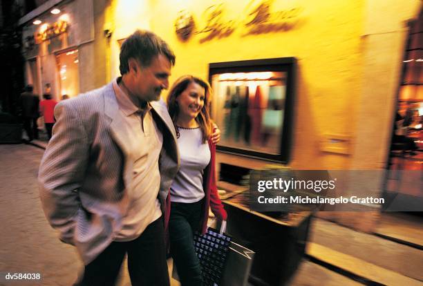 couple walking down via condotti, rome, italy - via stock pictures, royalty-free photos & images