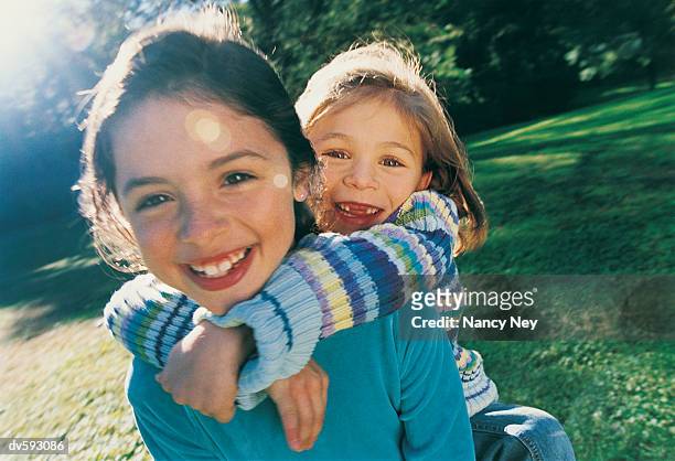 young girls playing at the park - nancy green stock pictures, royalty-free photos & images