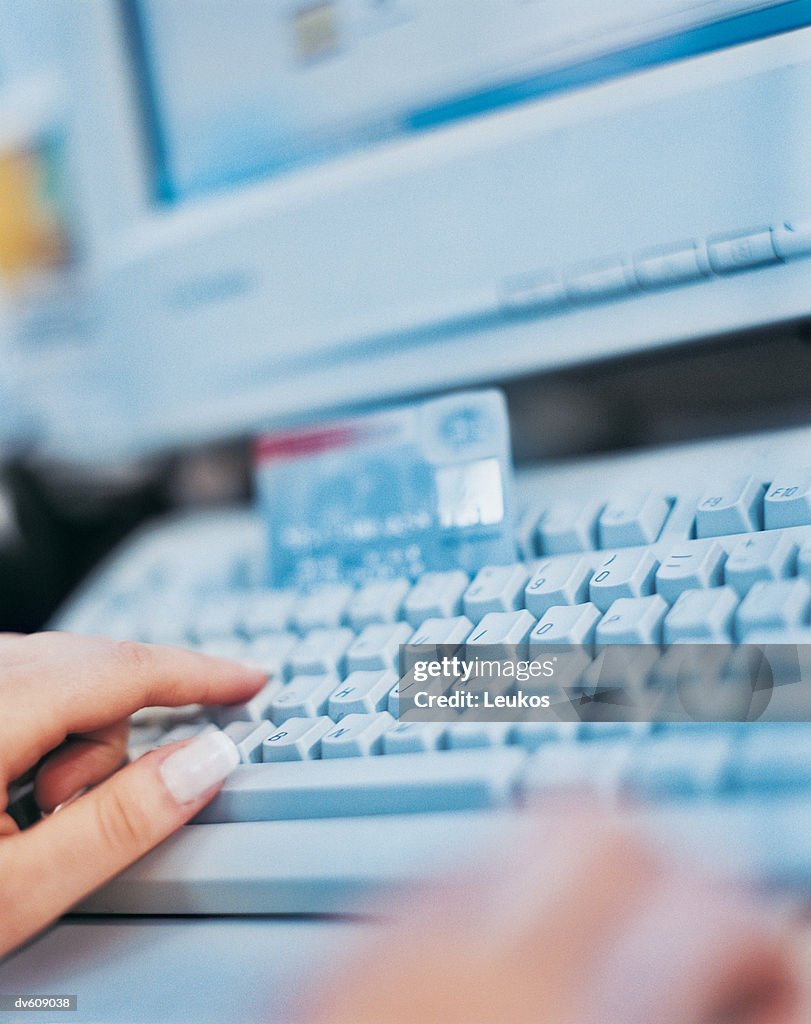 Hands Using Computer Keyboard