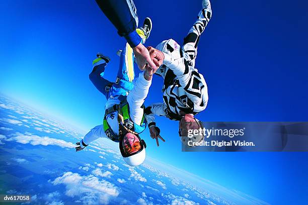women skydiving - extreme sports point of view stock pictures, royalty-free photos & images