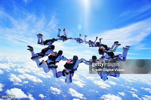 skydiving - group of people holding hands stock pictures, royalty-free photos & images