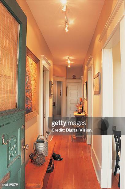 backdoor opens to a hallway - hintertür stock-fotos und bilder