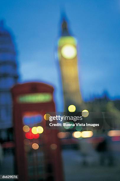 big ben and a telehpone box in a street at twilight, london, uk - buena vista stock pictures, royalty-free photos & images