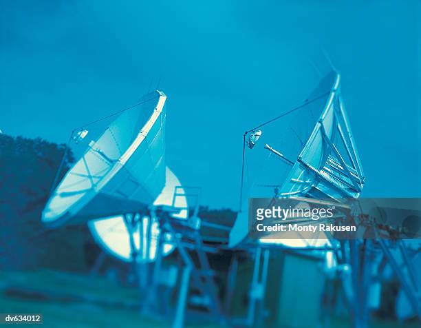 array of satellite radio dishes - monty rakusen stock-fotos und bilder