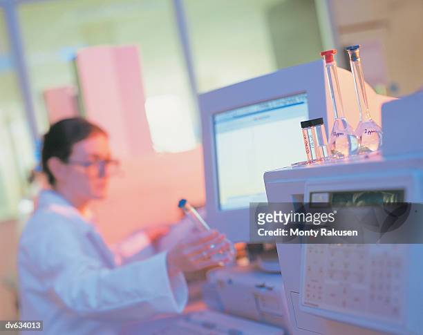 technician analysing substance in laboratory - monty rakusen stock-fotos und bilder
