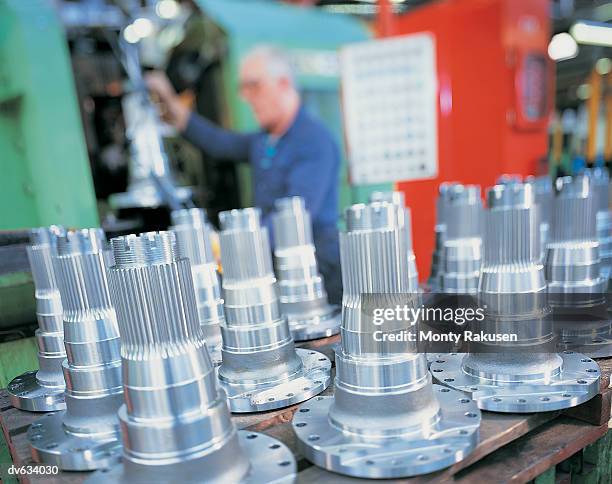 engineer producing mechanical parts - monty rakusen stock pictures, royalty-free photos & images