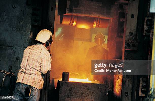 workers in foundry - monty rakusen stock-fotos und bilder