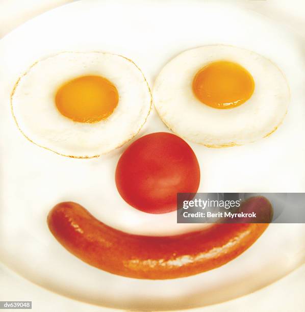 smiley face made of sausage and fried eggs - smiley face stock pictures, royalty-free photos & images