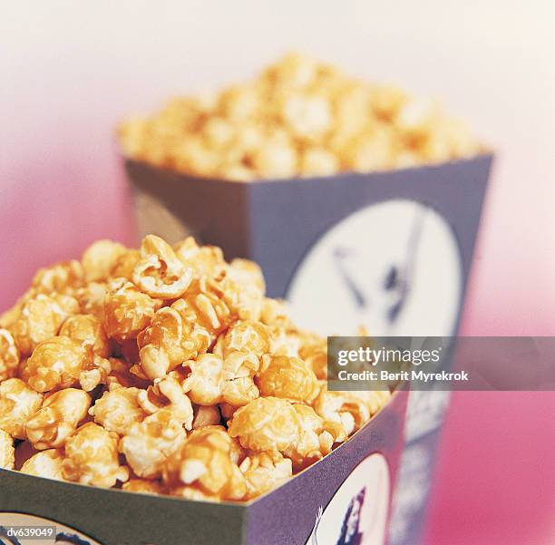 caramel covered popcorn - caramel popcorn stock pictures, royalty-free photos & images