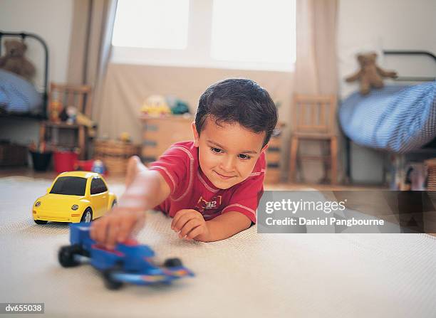 boy playing with toy car - daniel stock pictures, royalty-free photos & images