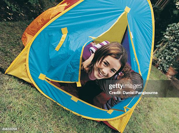 portrait of two girls in a tent - daniel stock pictures, royalty-free photos & images