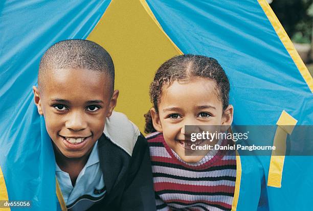 portrait of a boy and a girl in a tent - daniel fotografías e imágenes de stock