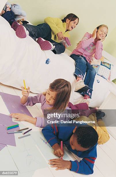 four children relaxing in a bedroom - daniel fotografías e imágenes de stock