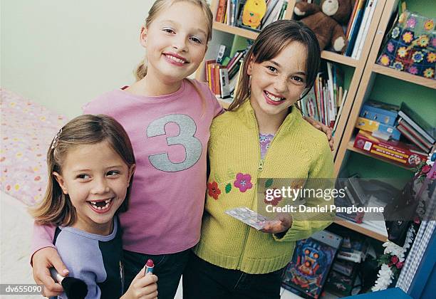 portrait of three girls wearing make-up - daniel stock pictures, royalty-free photos & images