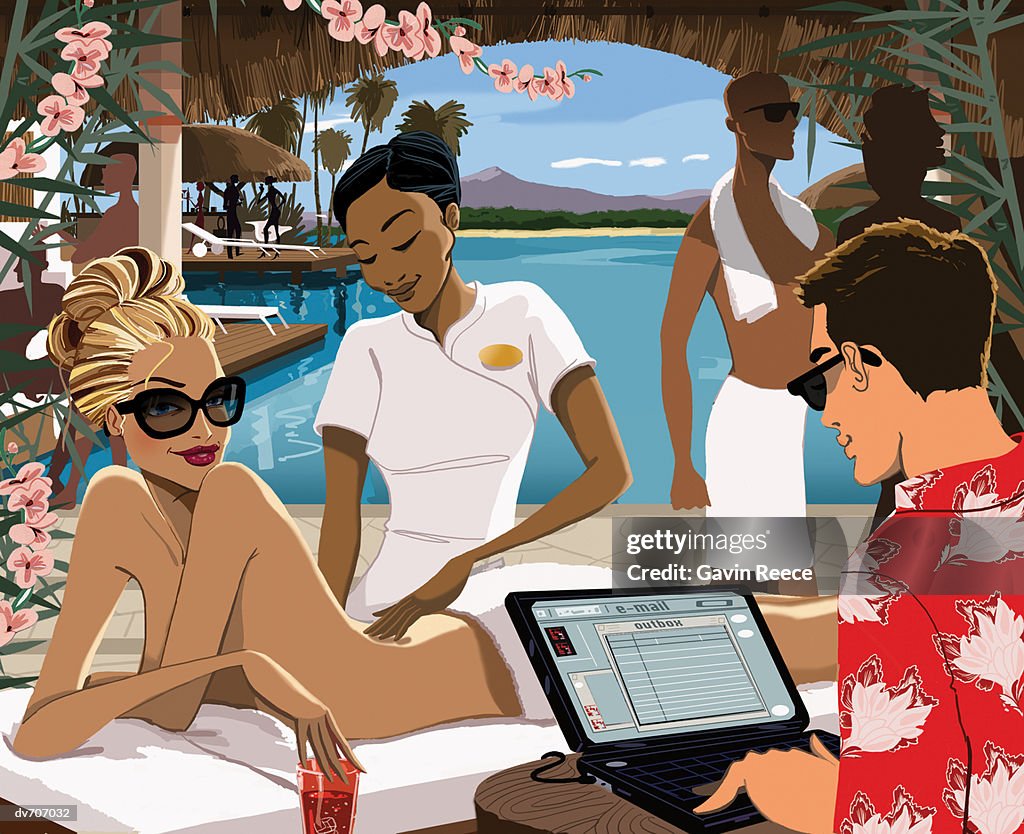 Woman Getting a Back Massage with Man Working on a Laptop