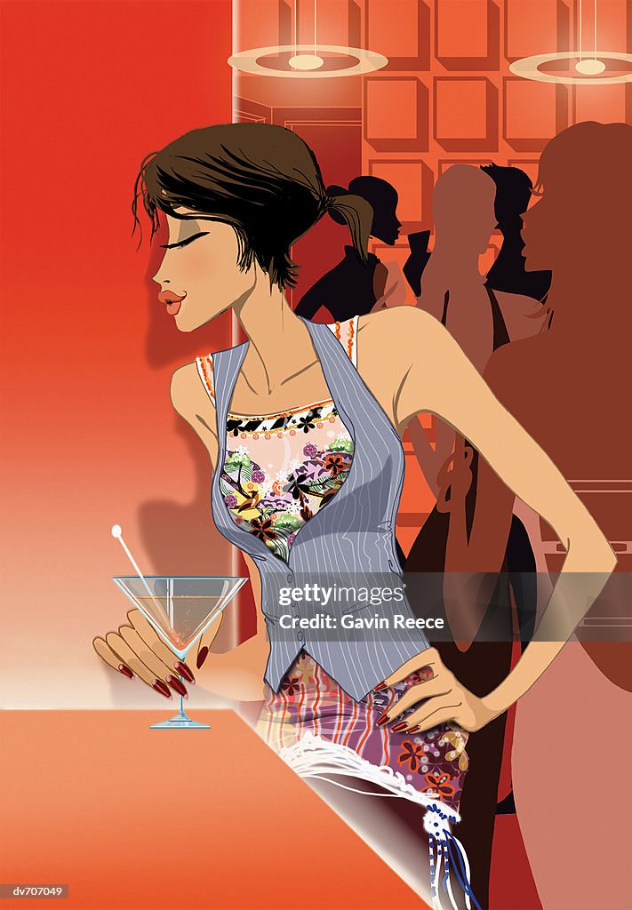 Woman Drinking a Cocktail at a Bar