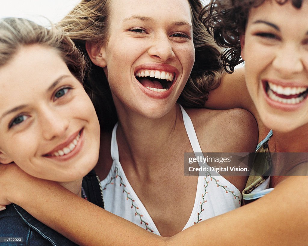 Portrait of Three Smiling Teenagers