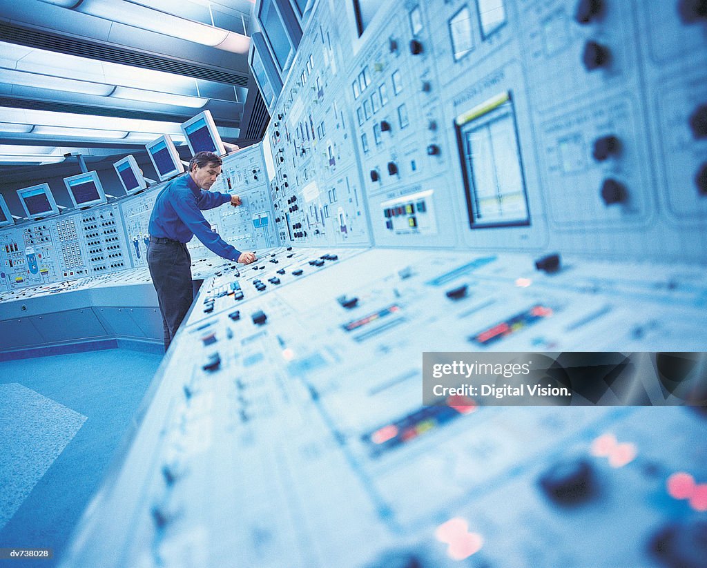 Engineer in control room of nuclear power station