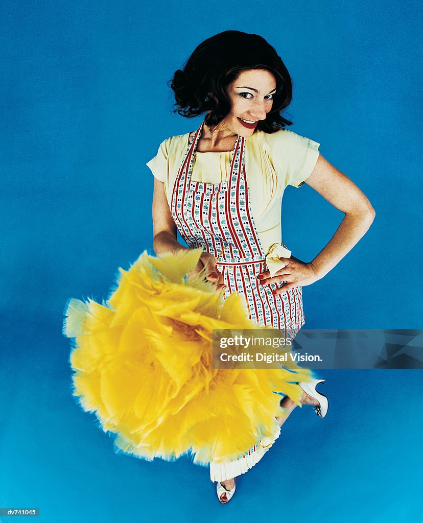 Portrait of a Housewife Holding a Feather Duster